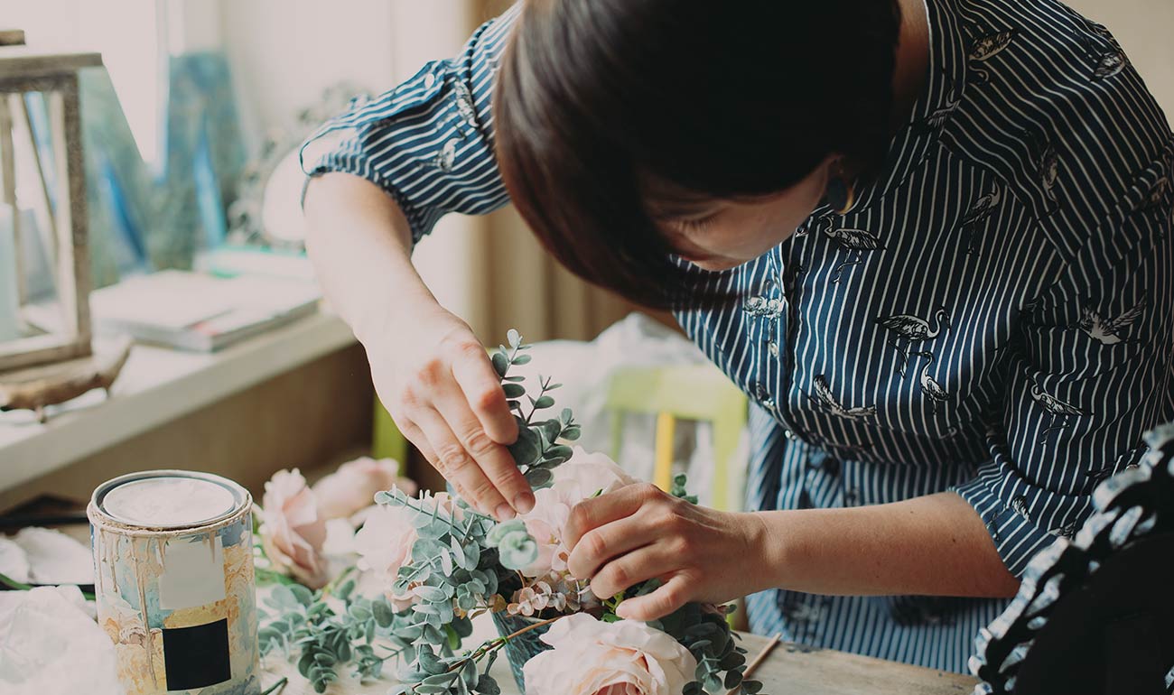 A place setting with a croissant and orange juice.
